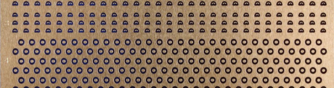 Photoetch fret showing three kinds of caps and rigols (“eyebrows”).